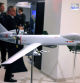 A model of an Airbus SE Eurodrone military drone in an exhibit at the Berlin Security Conference in Berlin, Germany, on Wednesday, Nov. 30, 2022. Germany and Norway proposed a NATO center to strengthen the protection of underwater pipelines and cables, underscoring heightened concerns that such infrastructure could be a target for sabotage. Photographer: Krisztian Bocsi/Bloomberg