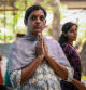 A devotee offers prayers to Lord Guruvayoorappan, a form of Lord Vishnu, during the celebration of Onam festival at a temple in Chennai on September 15, 2024. (Photo by R.Satish BABU / AFP)