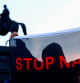 Dresden (Germany), 29/08/2024.- A protester agaisnt far-right Alternative for Germany (AfD) raises a 'Stop Nazi' banner, during a final election campaign rally of AfD party, in Dresden, Germany, 29 August 2024. Saxony state election, voting for the regional parliament 'Landtag', will be held on 01 September 2024. (Protestas, Alemania, Dresde) EFE/EPA/FILIP SINGER