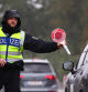 Walserberg (Germany), 16/09/2024.- German police officer stops a car at a border crossing point between Germany and Austria in Walserberg, Germany, 16 September 2024. According to the German Federal Ministry of the Interior and Community, the temporary reintroduction of border control at Germany'Äôs land borders with France, Luxembourg, the Netherlands, Belgium and Denmark has been ordered for six months, starting 16 September 2024. (Bélgica, Dinamarca, Francia, Alemania, Luxemburgo, Países Bajos; Holanda, Luxemburgo) EFE/EPA/ANNA SZILAGYI