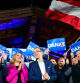 Herbert Kickl (2nd R), leader and top candidate of right-wing populist Freedom Party of Austria (FPOe) is celebrated by supporters at the party's election event after exit poll numbers where announced at the Stiegl-Ambulanz restaurant in Vienna, Austria on September 29, 2024, during Austria's general election. Austria's far right FPOe was ahead of the ruling conservatives in Sunday's national vote, according to projections published by public broadcaster ORF, setting them up for a historic win. (Photo by ROLAND SCHLAGER / APA / AFP)