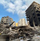 A picture shows a view of the destruction at the site of an Israeli overninght airstrike that targeted Beirut's southern suburb Rouweiss neighbourhood on October 10, 2024. The United States urged its ally Israel to avoid Gaza-like military action in Lebanon, after Prime Minister Benjamin Netanyahu said it could face 
