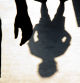 Blurry shadow silhouette of two boys confronting each other in school yard