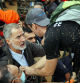 TOPSHOT - King Felipe VI of Spain (L) talks with a person as angry residents heckle him during his visit to Paiporta, in the region of Valencia, eastern Spain, on November 3, 2024, in the aftermath of devastating deadly floods. A delegation led by Spain's king and prime minister was heckled today as it visited the Valencia region hit by deadly floods, with some screaming 