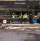 Police officers leave an underground parking garage at the Bonaire shopping mall on the outskirts of Valencia, eastern Spain, on November 5, 2024 as the search continues for victims after devastating floods in the region. The death toll from Spain's worst floods in a generation has climbed to 217, according to resuers. (Photo by Cesar Manso / AFP)