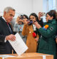 (FILES) Romania's presidential candidate Calin Georgescu votes during parliamentary elections at a polling station in Mogosoaia, near Bucharest, on December 1, 2024. Romanian police raided houses on December 7, 2024 linked to a probe into alleged irregularities in the first-round presidential election win of far-right outsider Calin Georgescu, a day after the top court cancelled the imminent run-off. Three houses in Brasov city in central Romania were being searched as part of the investigation 