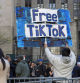 FILE - A man carries a Free TikTok sign in front of the courthouse where the hush-money trial of Donald Trump was underway on April 15, 2024, in New York. (AP Photo/Ted Shaffrey, File)
