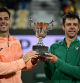 Spain's Marcel Granollers (L) and Argentina's Horacio Zeballos hold their trophy after winning their men's doubles final match against Britain's Joe Salisbury and Britain's Neal Skupski on day 14 of the French Open tennis tournament on Court Philippe-Chatrier at the Roland-Garros Complex in Paris on June 7, 2025. (Photo by JULIEN DE ROSA / AFP)