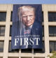 A portrait of President Donald Trump hangs on the Labor Department headquarters near the Capitol in Washington, Friday, Aug. 29, 2025. (AP Photo/Jose Luis Magana)