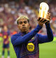 Soccer Football - LaLiga - FC Barcelona v Real Sociedad - Estadi Olimpic Lluis Companys, Barcelona, Spain - September 28, 2025 FC Barcelona's Lamine Yamal lifts his Kopa Trophy in front of the fans before the match REUTERS/Albert Gea