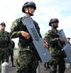 Colombian soldiers hold anti-drone weapons during the activation of the first unmanned aircraft battalion at the military base in Tolemaida, Colombia, on October 10, 2025. The Colombian army unveiled its first drone battalion on October 10, 2025, designed to attack and defend against illegal armed groups such as guerrillas, which use this type of aircraft to target both military personnel and civilians in a tactic that has transformed the armed conflict. (Photo by Raul ARBOLEDA / AFP)