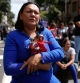 A government supporter holds dolls of President Nicolás Maduro and his wife, Cilia Flores, during a rally in Caracas, Venezuela, Saturday, Jan. 3, 2026, after U.S. President Donald Trump announced that Maduro had been captured and flown out of the country. (AP Photo/Ariana Cubillos)