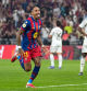 Barcelona's Raphinha, center, celebrates after scoring his second goal during the Spanish Super Cup final soccer match against Real Madrid at King Abdullah Sports City Stadium in Jeddah, Saudi Arabia, Sunday, Jan. 11, 2026. (AP Photo/Altaf Qadri)