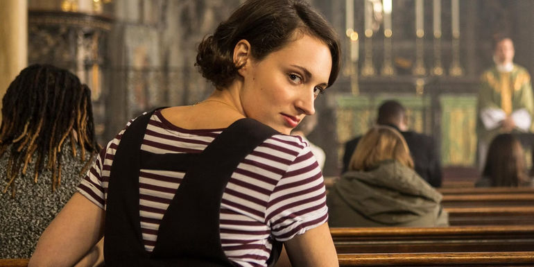 Fleabag looks over her shoulder in church in Fleabag.
