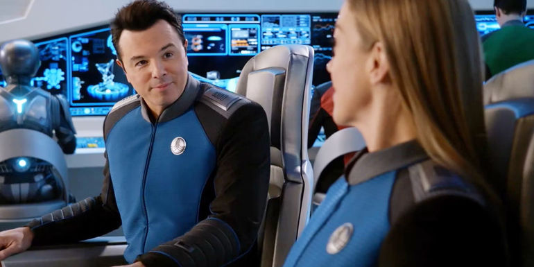 Seth MacFarlane as Captain Ed Mercer looking happily at Adrianne Palicki in The Orville