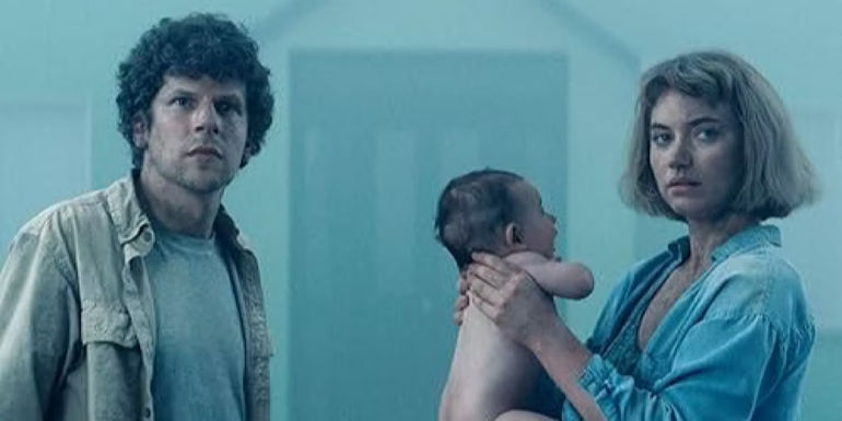 Gemma and Tom look out as Gemma holds a baby up in Vivarium.