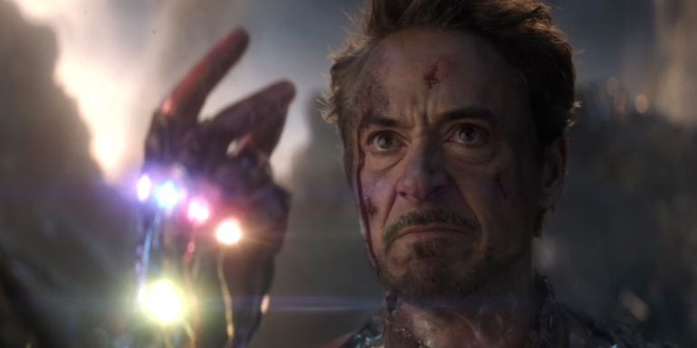 Robert Downey Jr.'s Iron Man snapping the Infinity Gauntlet in Avengers: Endgame