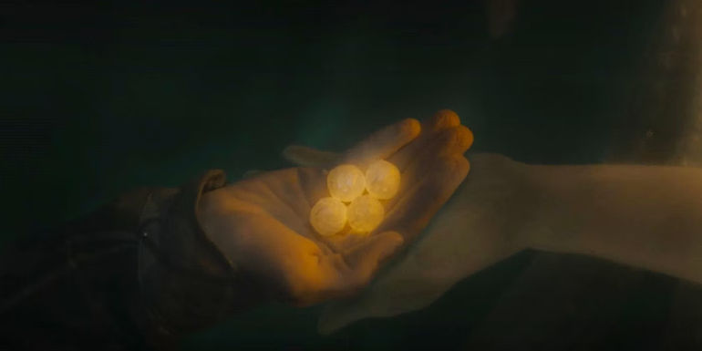 Percy holding Poseidon's Pearls in Percy Jackson episode 6