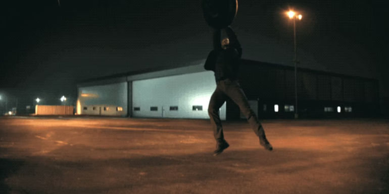 Alan Ritchson's Reacher hanging on a helicopter