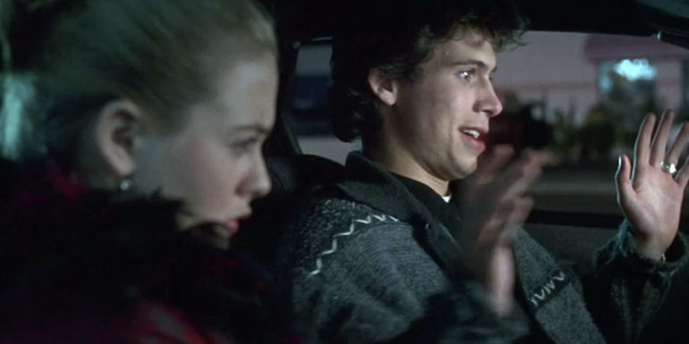Elton (Jeremy Sisto) looking annoyed in a car with Cher (Alicia Silverstone) in Clueless