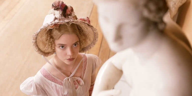 Emma (Anya Taylor-Joy) staring up at a statue in Emma.