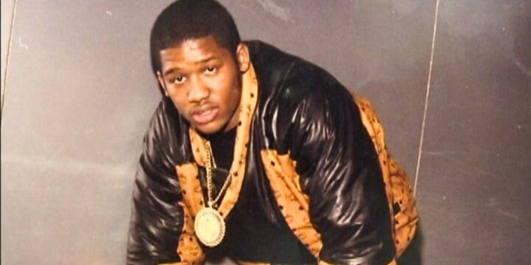 Alpo Martinez looking into the camera and bending