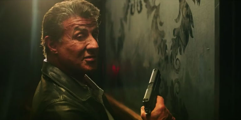 Sylvester Stallone's Breslin holding a pistol in Escape Plan 2