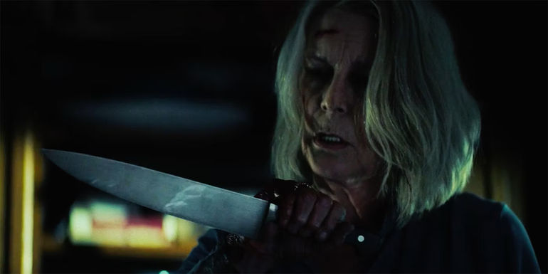 Michael Myers reflected in Laurie Strode's knife in Halloween Ends