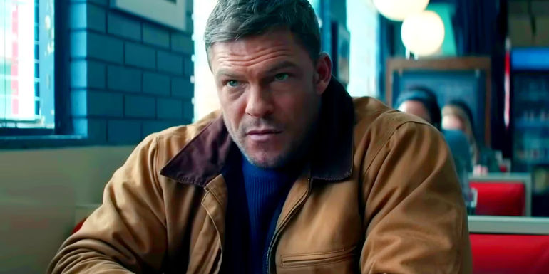 Alan Ritchson as Jack Reacher Sitting in a Diner in Reacher Season 2