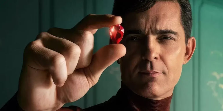 Berlin (Pedro Alonso) holds up a jewel in Money Heist