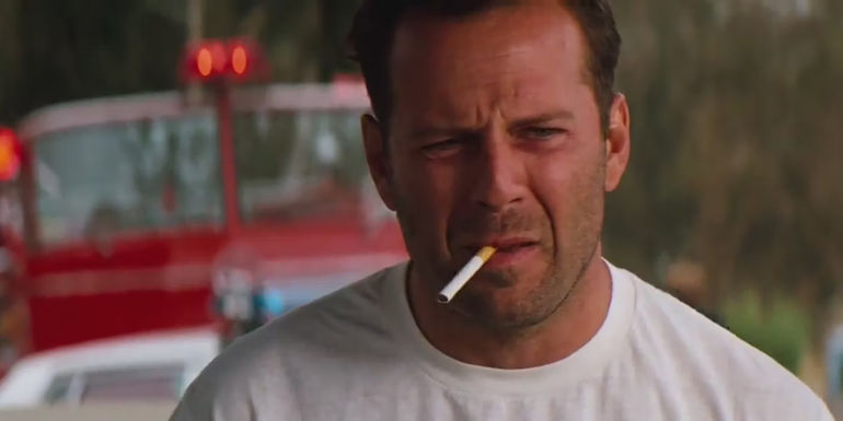 Bruce Willis as Hallenbeck smoking and looking tired in The Last Boy Scout