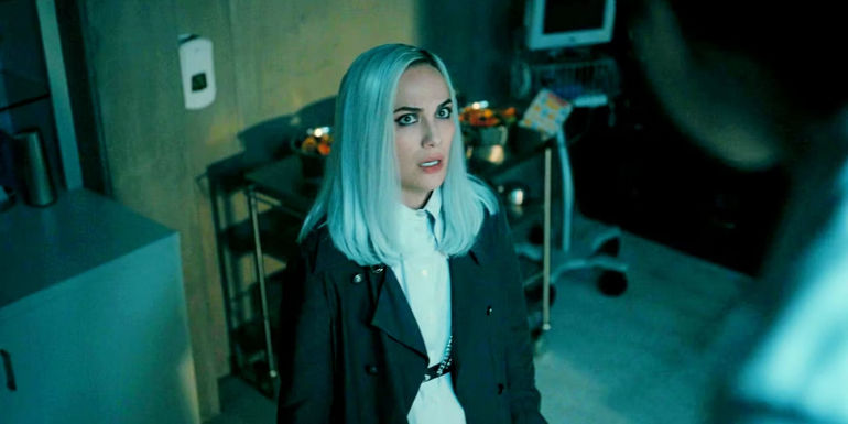 Camille (Kate Siegel) looking horrified while in the chimpanzee enclosure room in The Fall of the House of Usher