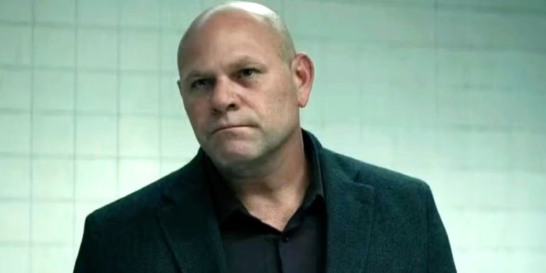 Gaitano Guy Russo (Domenico Lombardozzi) intensely looking at someone in Reacher season 2