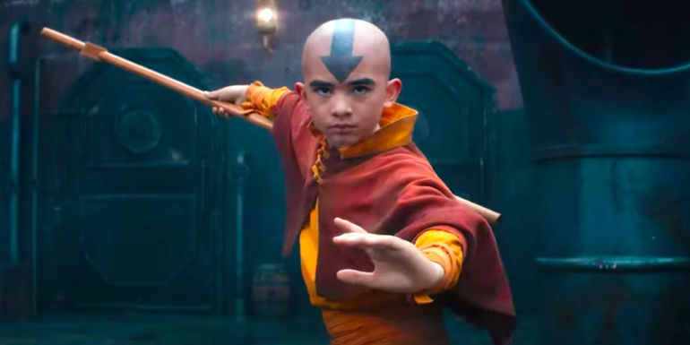 Aang in a fighting stance with his staff while on a Fire Nation ship in Avatar The Last Airbender Live-Action trailer.