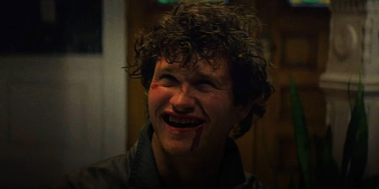 Corey Cunningham grinning menacingly in Halloween Ends