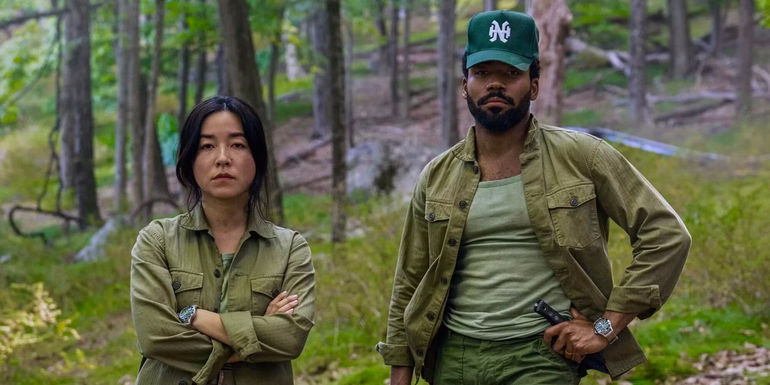 Donald Glover and Maya Erskine in the woods in Mr. and Mrs. Smith TV Show