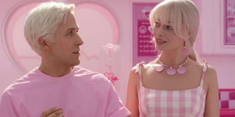 Ken (Ryan Gosling) and Barbie (Margot Robbie) dressed in all pink at the pink doctors' office in Barbie.
