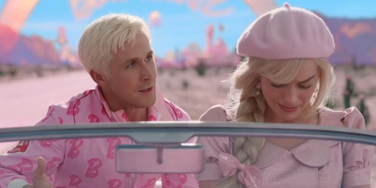 An all-pink Ken (Ryan Gosling) sits in the back seat while an all-pink Barbie (Margot Robbie) sits in the driver's seat of her car with her head down in Barbie.