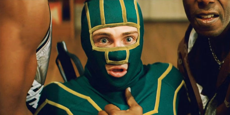 Kick-Ass in Costume and in Trouble Looking Shocked