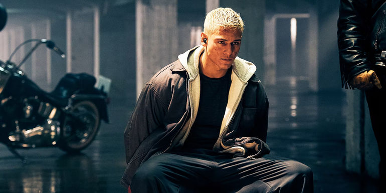 Netflix Sixty Minutes Octa tied to a chair in a parking lot