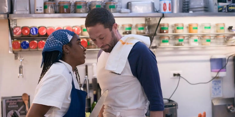 Sydney holding a knife up to Richie