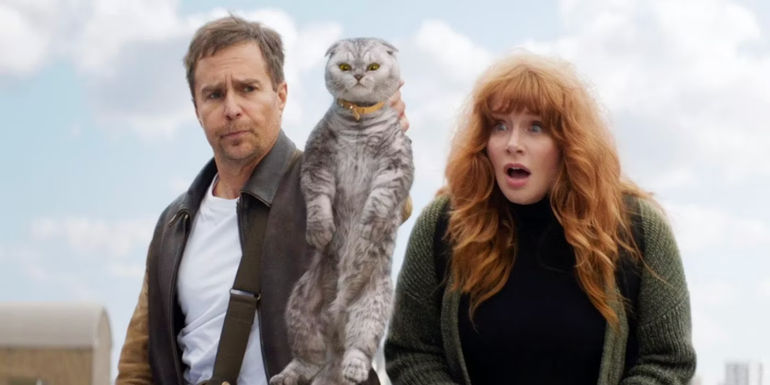 Sam Rockwell and Bryce Dallas Howard holding a cat in Argylle