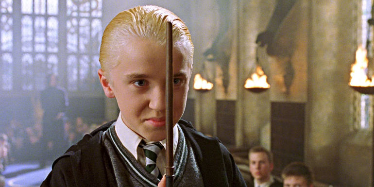 Draco with his wand in Harry Potter