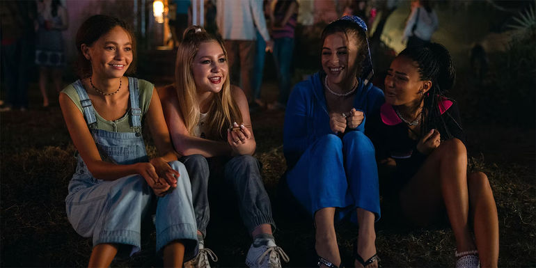 four friends sitting on porch steps in Suncoast