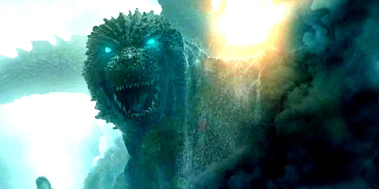 Godzilla with his bright blue eyes and lots of debris around it in Godzilla Minus One