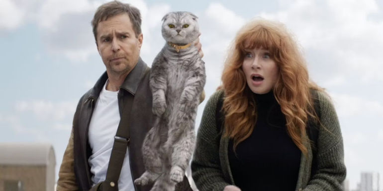Sam Rockwell holding a cat and Bryce Dallas Howard looking surprised as their characters in Argylle