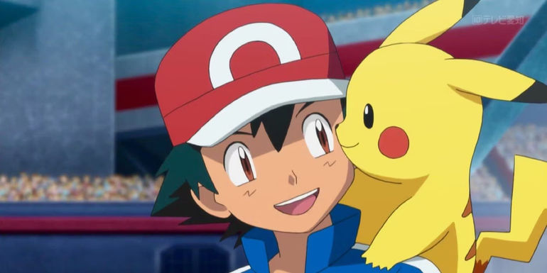 Ash and Pikachu smiling at each other in Pokémon
