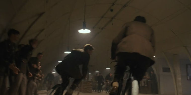 Gale Cleven and John Egan riding bikes Masters of the Air