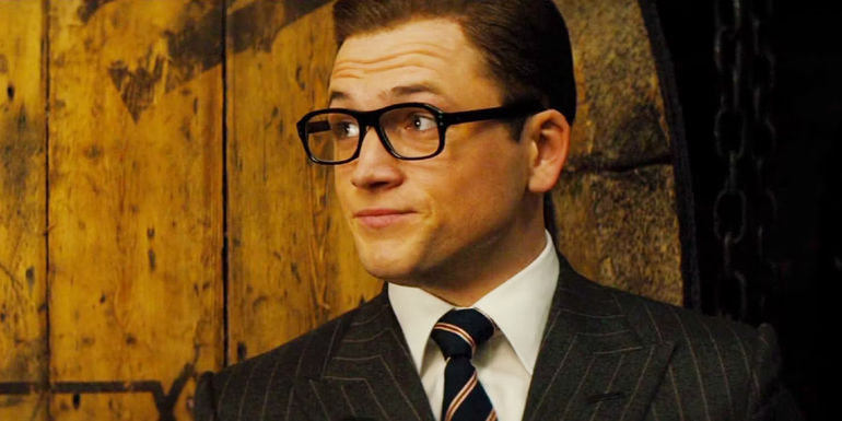 Taron Egerton smiling as Eggsy in Kingsman: The Golden Circle