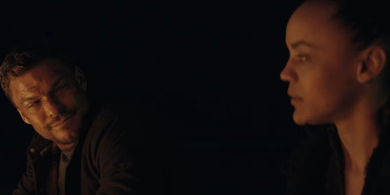 Alan Ritchson as Reacher smiling at Maria Sten as Frances Neagley in Reacher